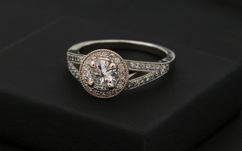 silver diamond ring on black box
