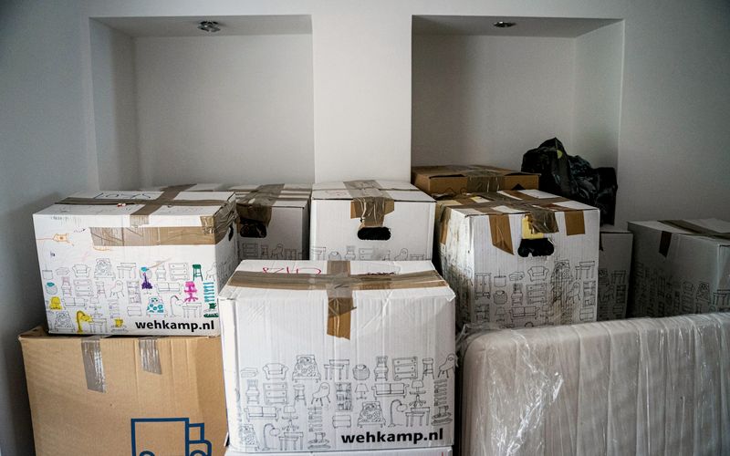 brown cardboard boxes on brown wooden table
