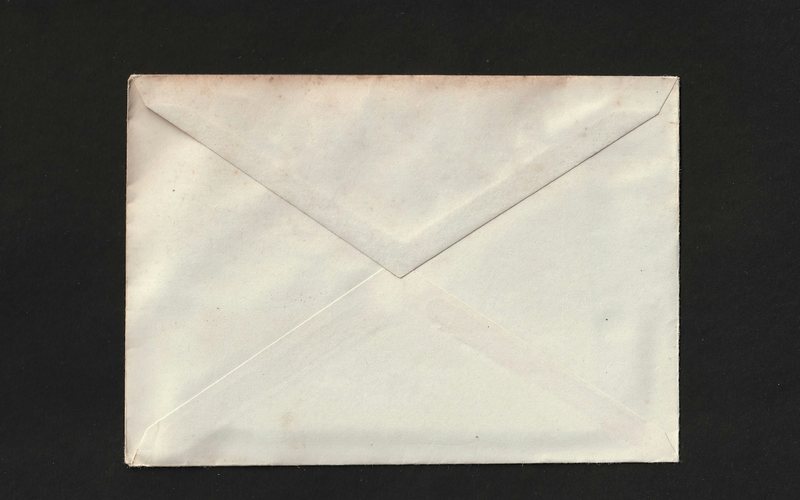 A white envelope on a black background