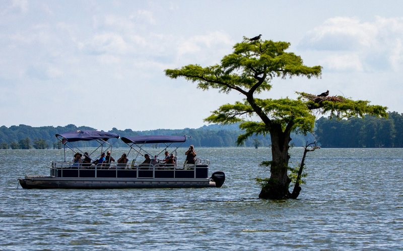 a boat with people on it in the water