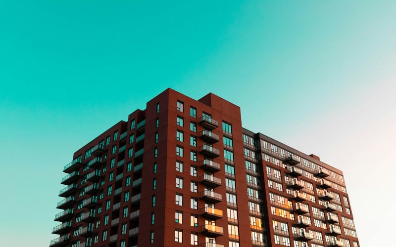 brown concrete building under blue sky during daytime